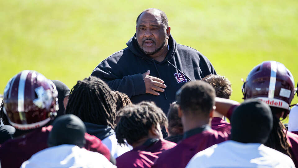 Heights head coach Stephen Dixon, Sr. is pictured speaking to his team on the field before a Region III-6A Division II bi-district game high school football game between Heights and Stratford Saturday, Nov 12, 2022, in Houston.