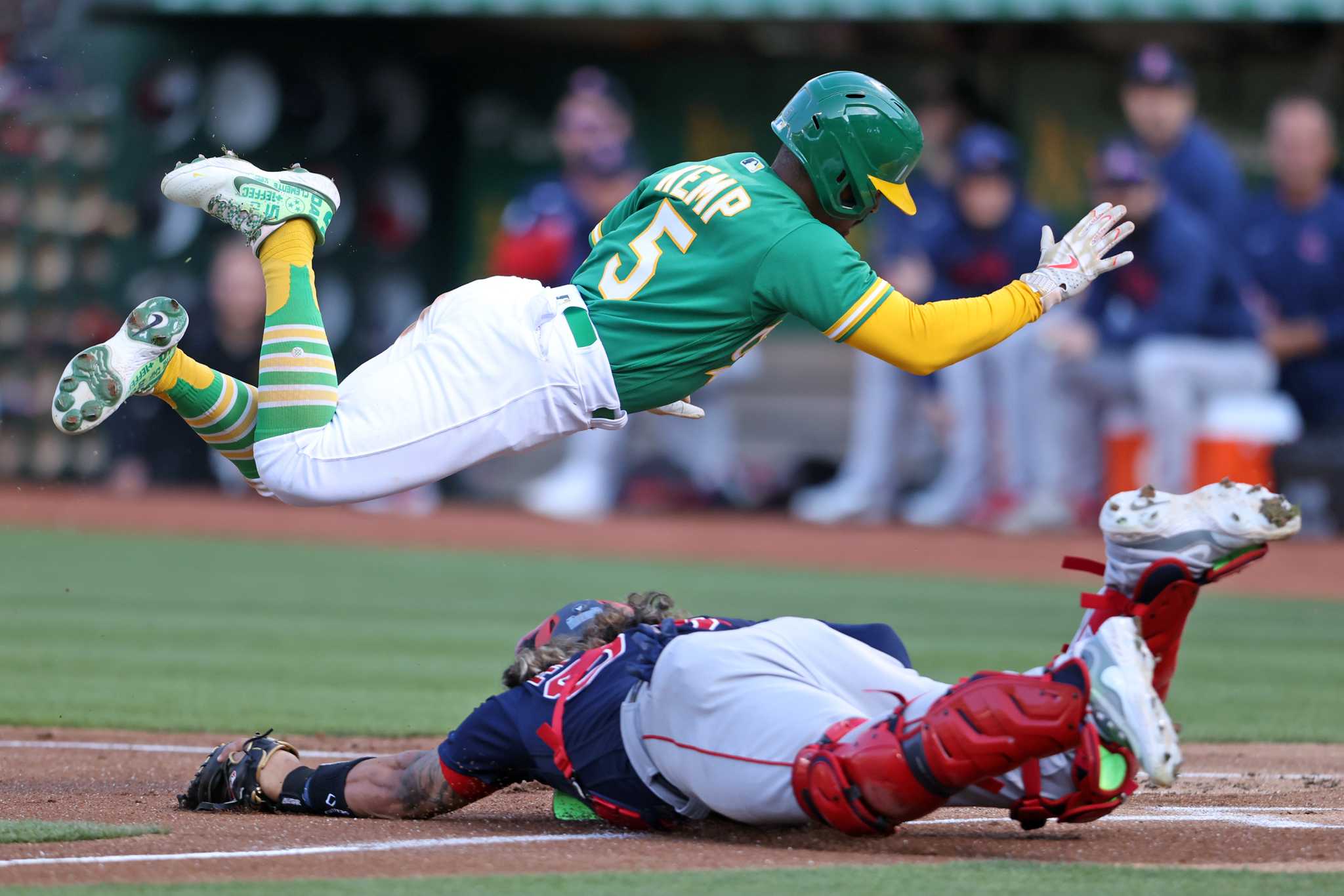 Early emotion and power propel A's past Boston in season's 2nd