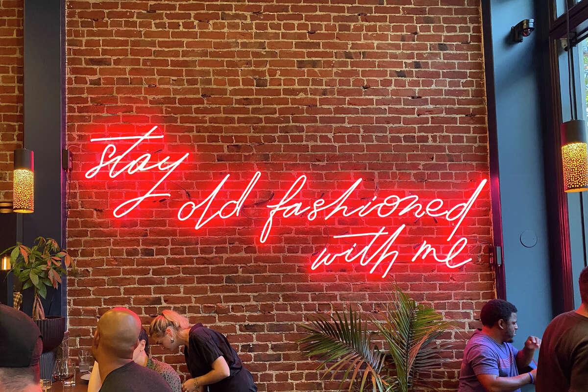 An Instagrammable neon sign inside Matty's Old Fashioned.