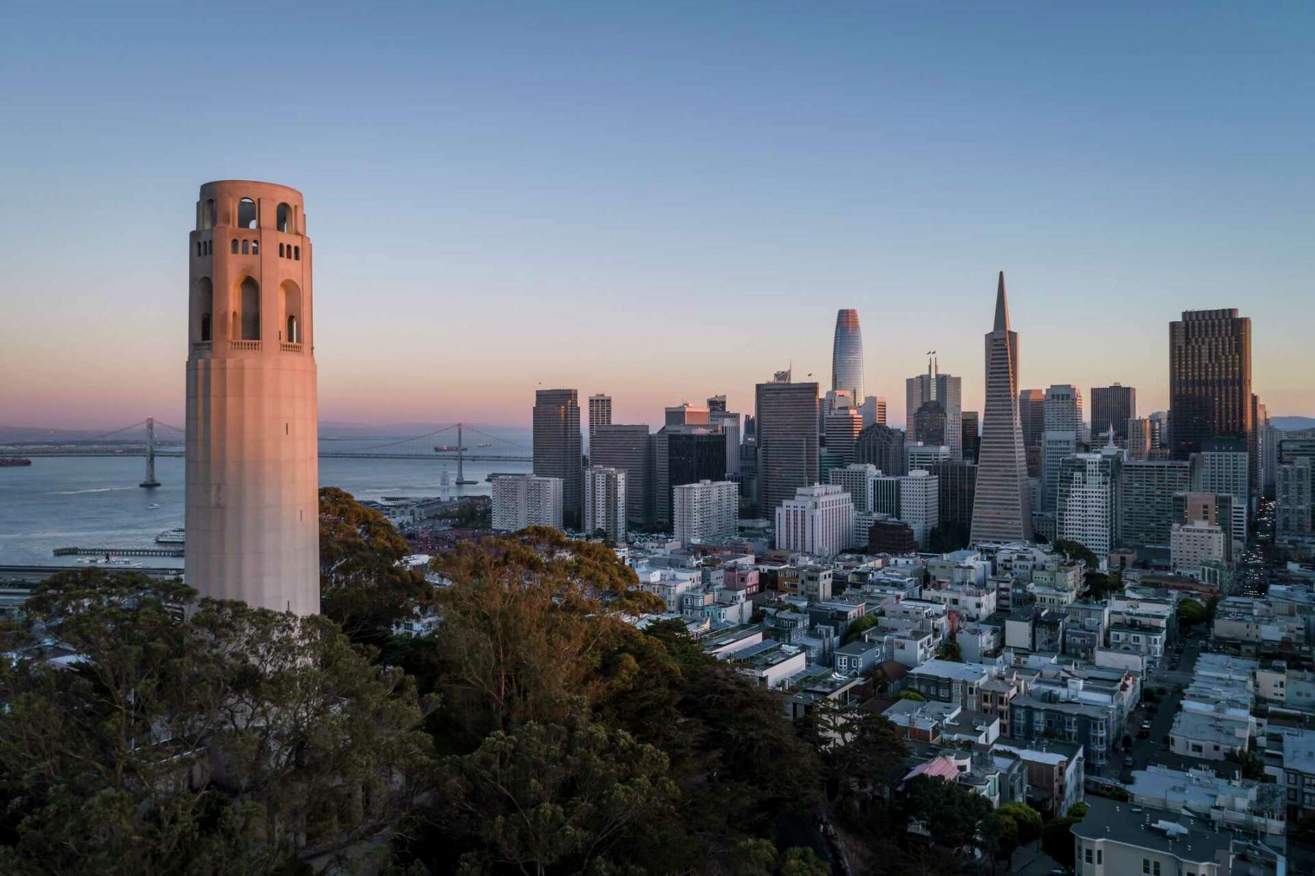 The Transamerica Pyramid is seen behind Coit Tower in the Financial District in San Francisco, Calif., on Thursday, October 27, 2022. The city’s iconic Transame