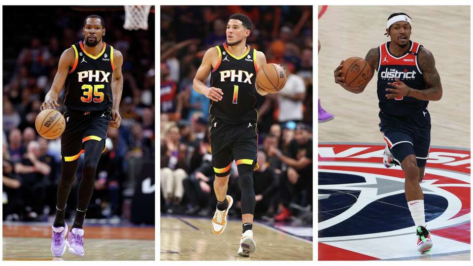 The Suns' newest acquisition of Bradley Beal, far right, could form a formidable Big Three with Kevin Durant and Devin Booker. 