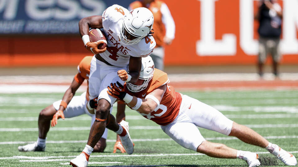 CJ Baxter, running in the Texas spring game, is one of a growing number of player from Florida on the Longhorns' roster.