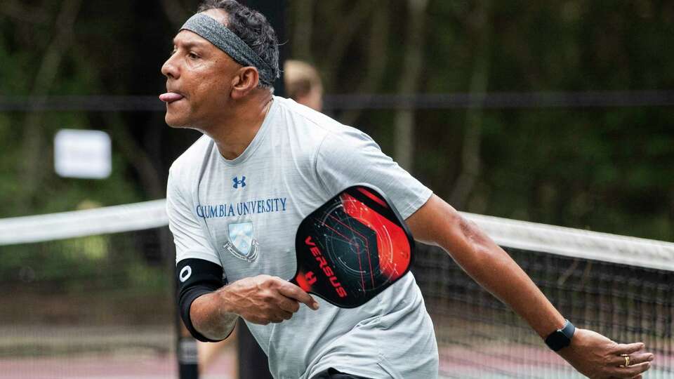 Mukund Devanathan returns a hit during a game of pickleball in the DUPR Platinum Ticket Local Waterfall Tournament at Shadowbend Park, Saturday, July 22, 2023, in The Woodlands. Winners of the tournament advanced to play in the national tournament in Rockwall, Texas, in October.