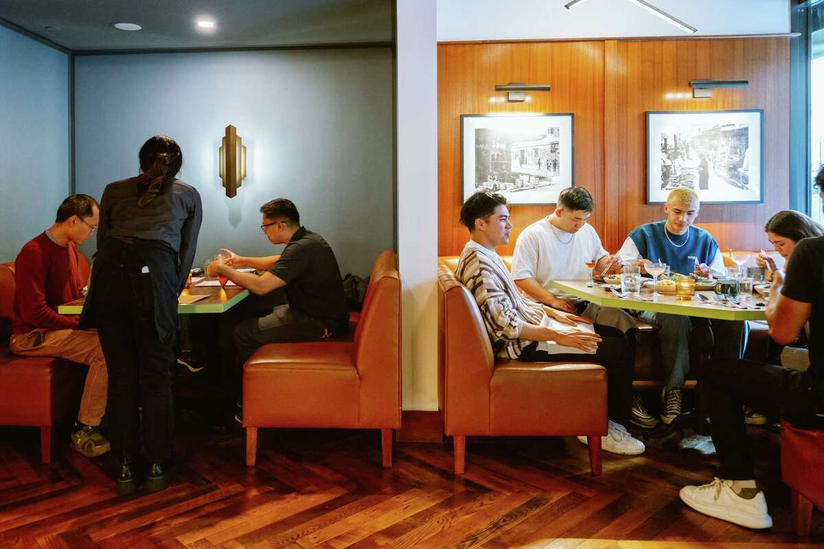 Diners eat at Bodega SF. Owner Matt Ho said customers will often then proceed to his downstairs bar, the Felix.