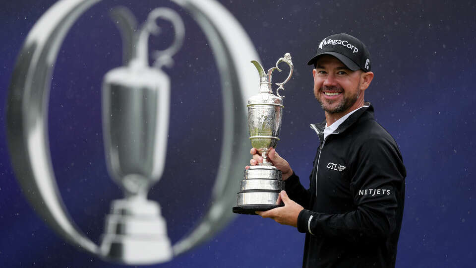 Brian Harman of the United States poses for a photograph with the Claret Jug on the 18th green after winning The 151st Open on Day Four of The 151st Open at Royal Liverpool Golf Club on July 23, 2023 in Hoylake, England. (Photo by Warren Little/Getty Images)