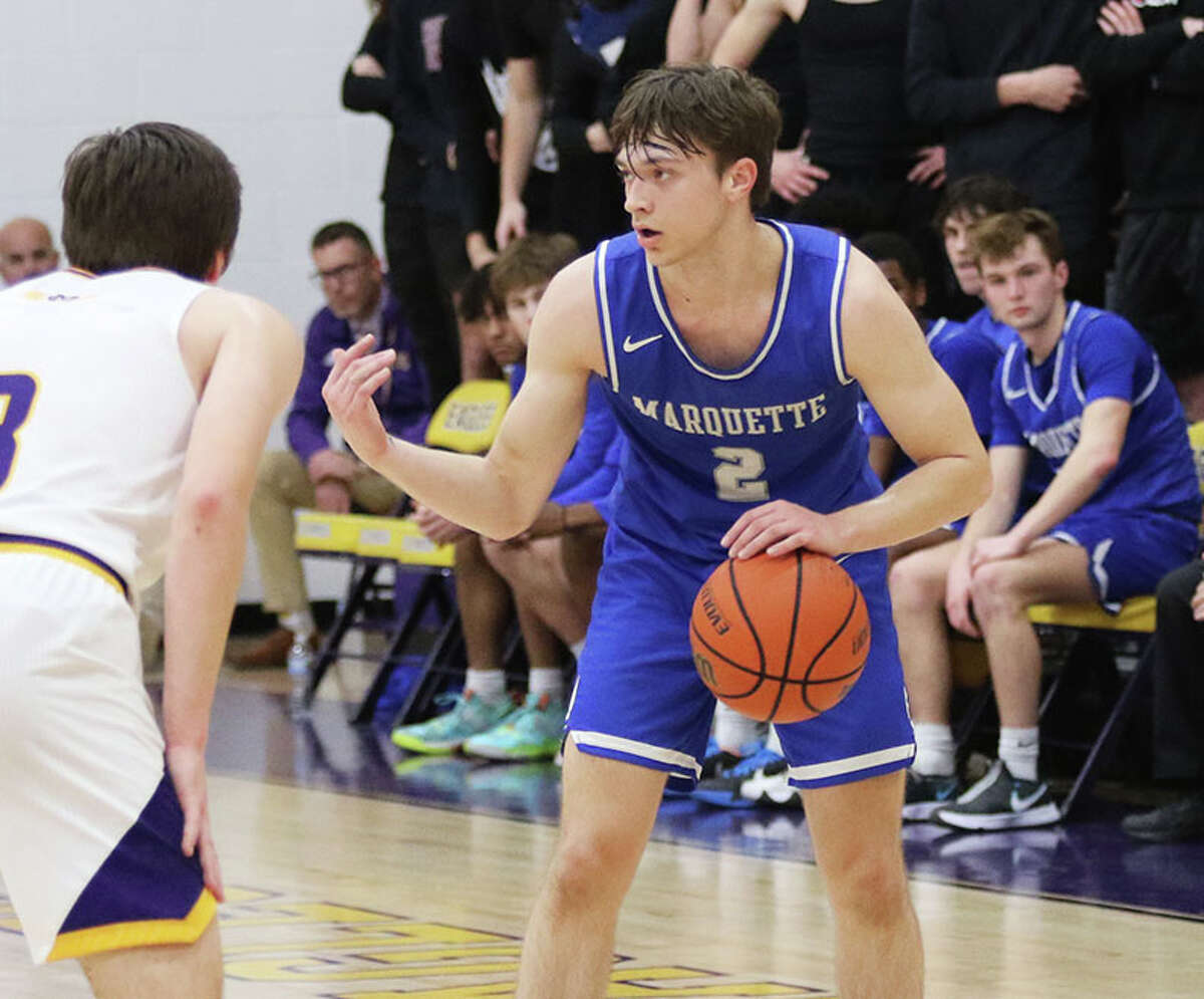 Marquette Catholic's Braden Kline handles the ball against CM in a February game in Bethalto.