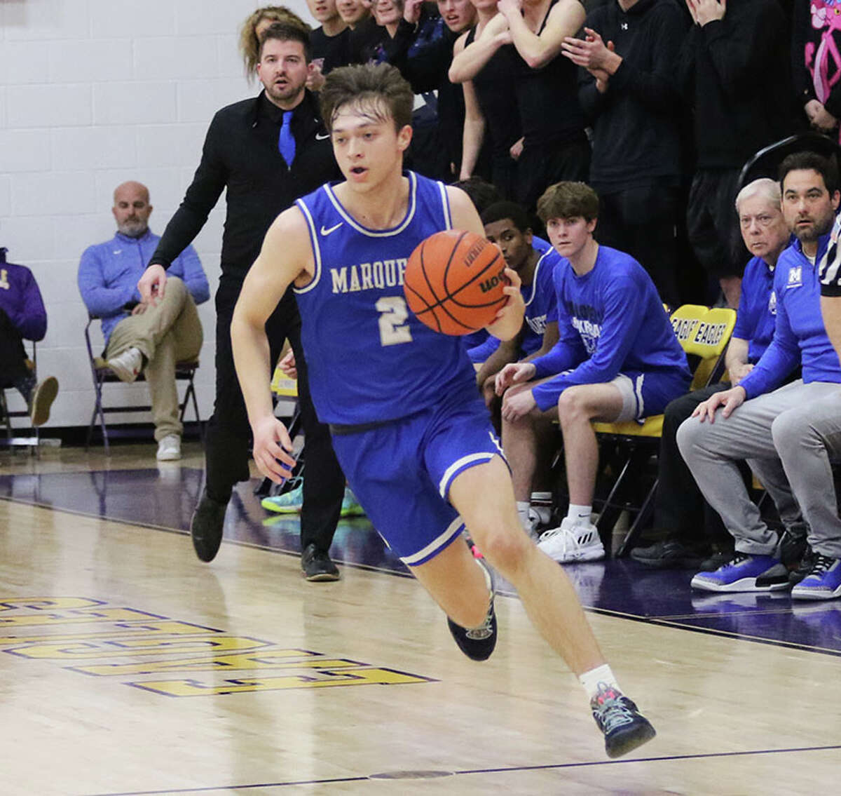 Marquette Catholic's Braden Kline pushes the ball upcourt against CM in a Feb. 14 game at Bethalto.  