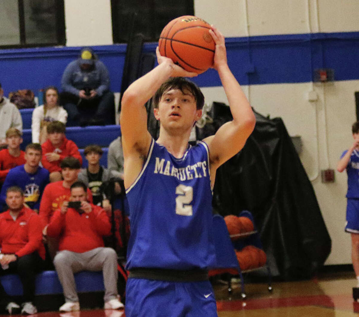 Marquette Catholic's Braden Kline shoots a 3-pointer in a game last November at the Roxana Hoopsgiving Classic.