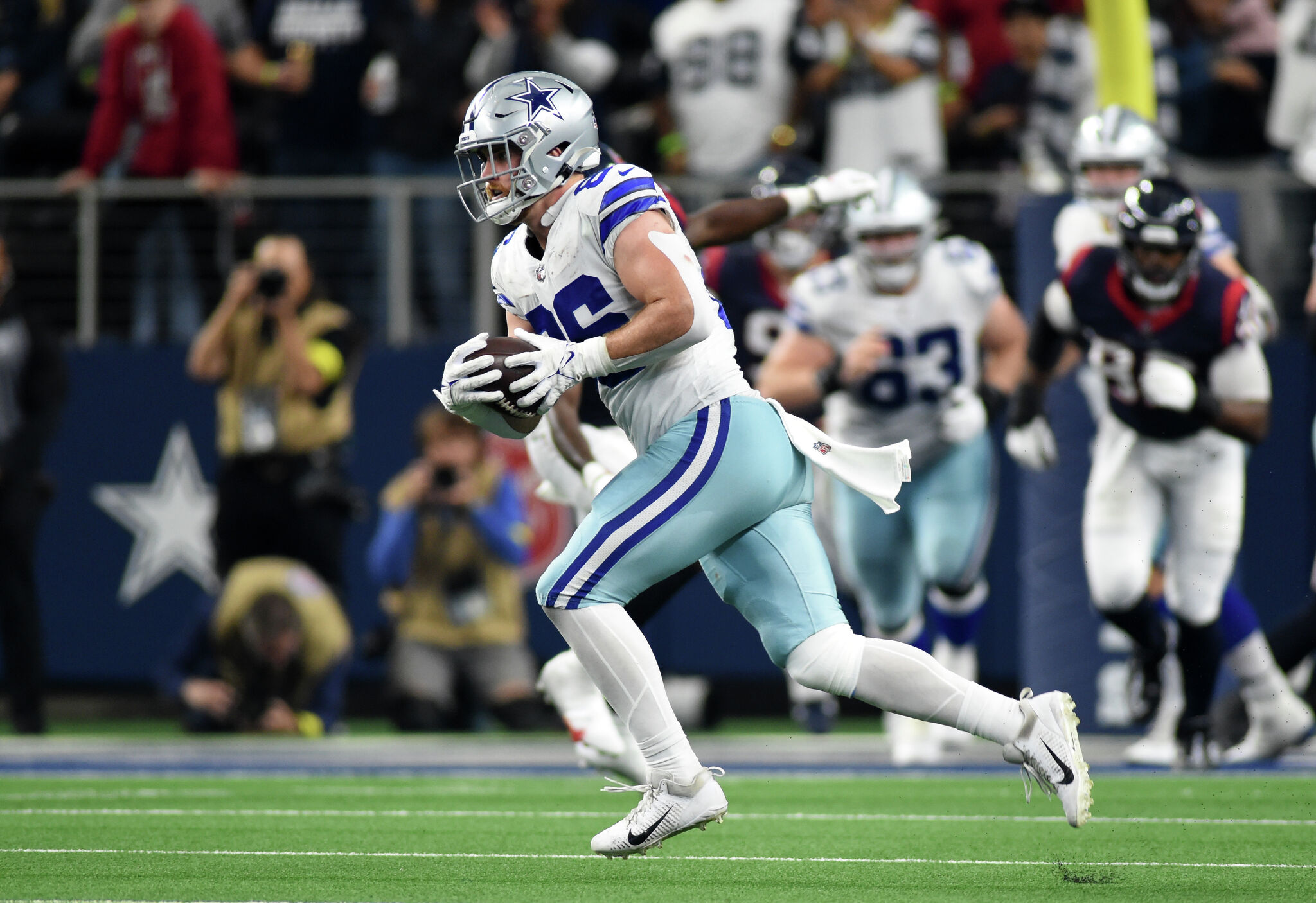 FILE - New Orleans Saints' Jim Taylor (31) runs for a first down as Dallas  Cowboys' Chuck Howley (54) pursues in the third quarter of an NFL football  game in Dallas, Oct.