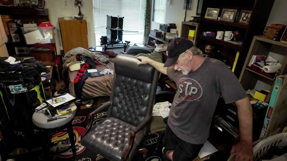 Ronnie Payne, a U.S. Army veteran, stands in his apartment at Travis Street Plaza on Tuesday, July 25, 2023 in Houston. Cloudbreak owns three buildings where formerly homeless veterans are supposed to receive permanent supportive housing. But veterans living there say that they live under constant threat of eviction and they do not receive support in navigating payments through the HHA. The properties have a record of evicting veterans for not paying their rent. Payne has been served an eviction notice.