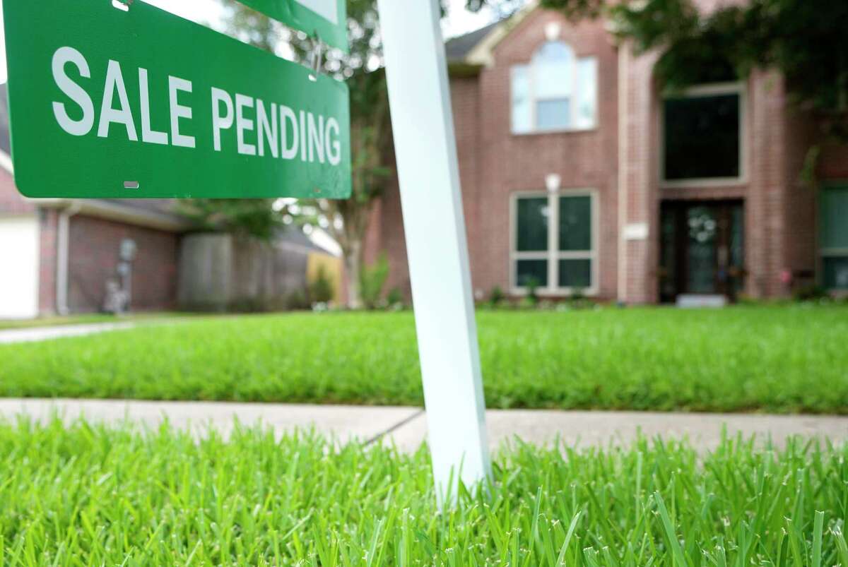 A sale pending sign is shown outside a home for sale on Tuesday, July 25, 2023 in Spring.