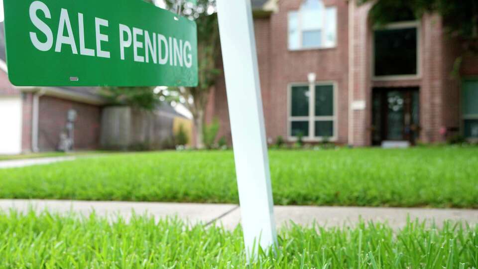 A sale pending sign is shown outside a home for sale on Tuesday, July 25, 2023 in Spring.