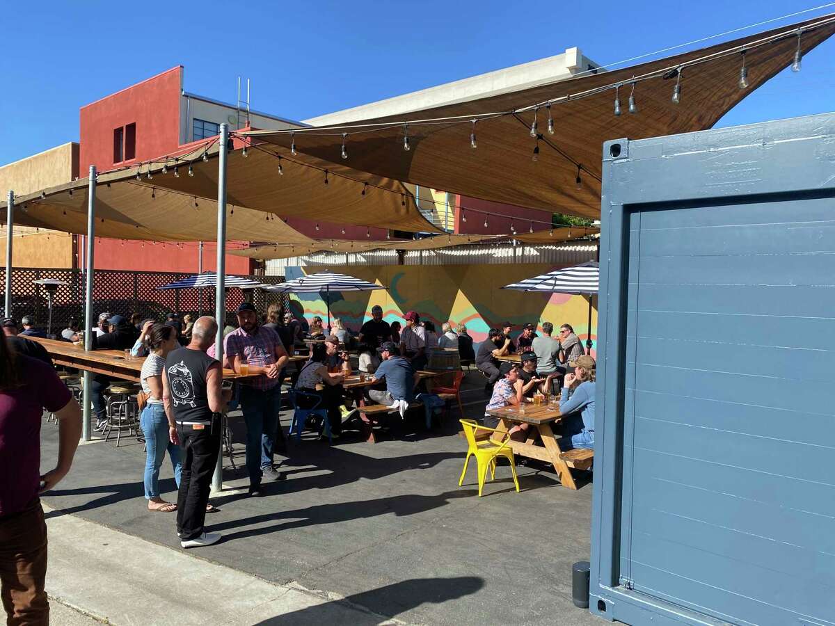 Customers enjoy cold beers at Cellarmaker Brewing Co.'s new Berkeley brewery and beer garden. The latest from the popular brewery founded in San Francisco features plenty of outdoor seating and 12 taps pouring house beers.