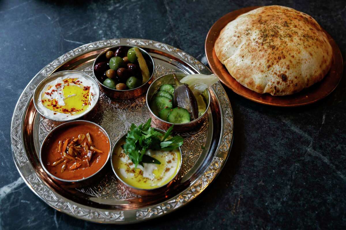 Dalida's "breaking bread" plate with fresh-baked pita and dips.