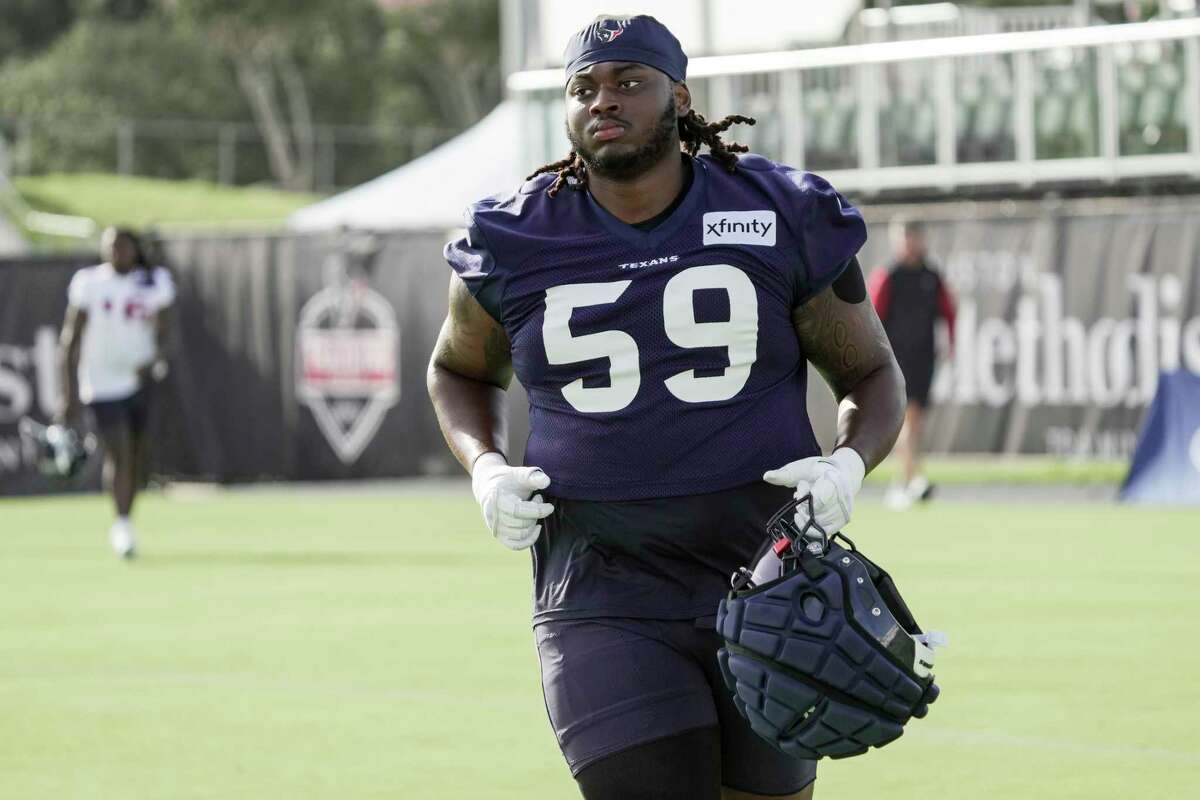 Houston Texans defensive tackle Thomas Booker IV (56) warms up before  taking on the New York