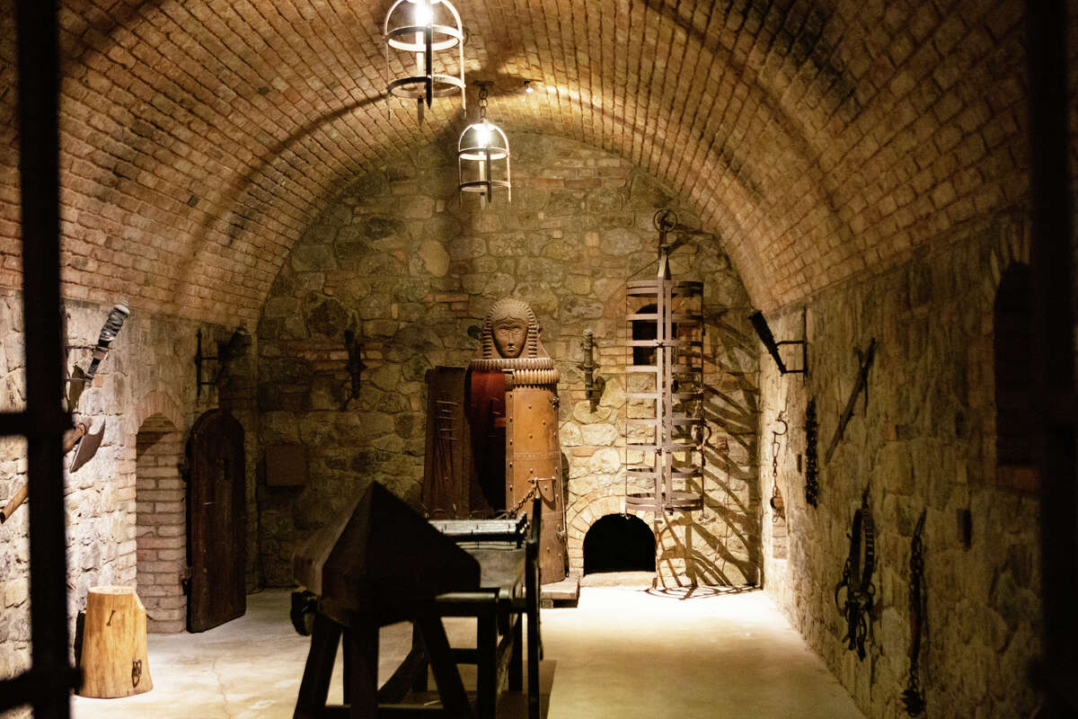 The castle includes a replica torture room with torture devices and swords.