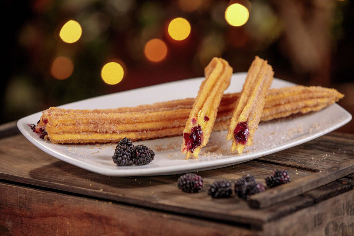 A plate of boysenberry-filled churros are shown at Knott's Berry Farm in Buena Park, Calif.