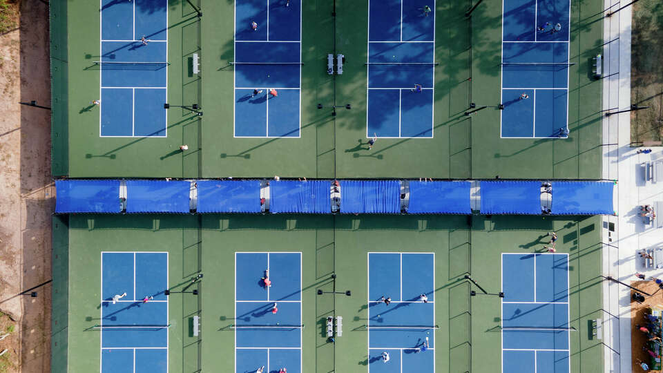 Pickleball players enjoy The Woodlands Township's first-ever pickleball courts at Falconwing Park, Saturday, July 22, 2023, in The Woodlands.