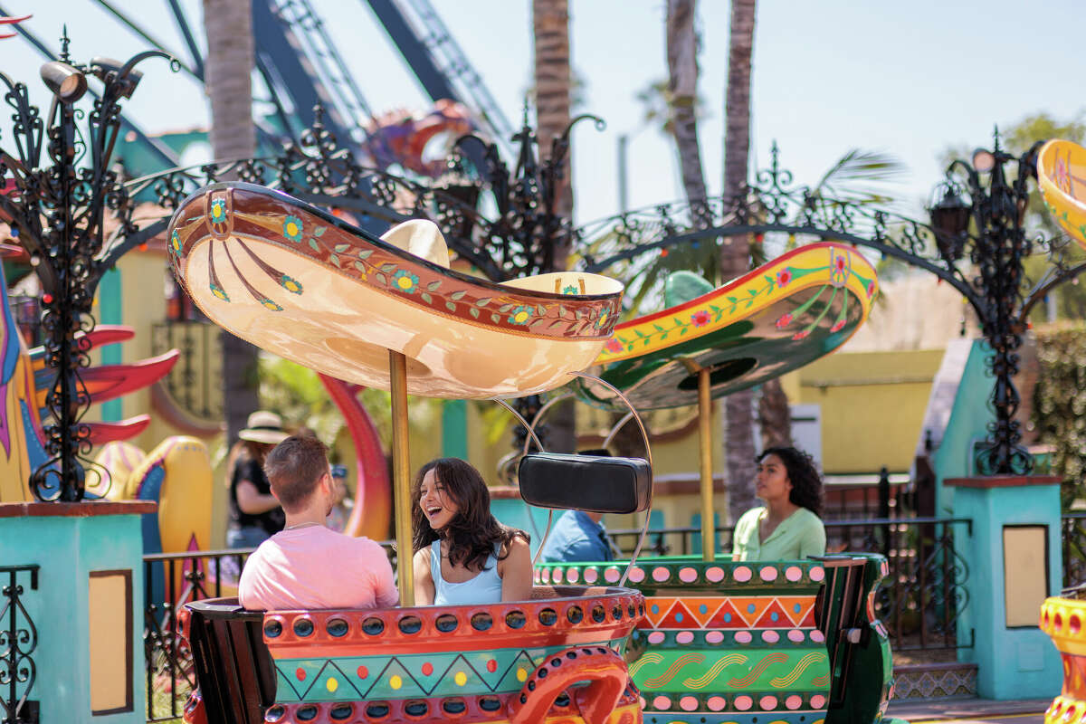 Guests at Knott's Berry Farm ride the Hat Dance in the Fiesta Village section of the park.