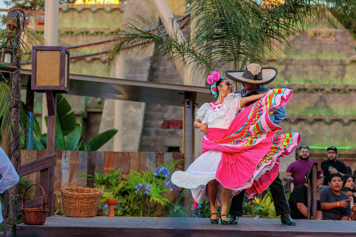 Dancers entertain visitors at Fiesta Village at Knott's Berry Farm in Buena Park, Calif. The newly reimagined section of the park leans heavily into its Hispanic influences.