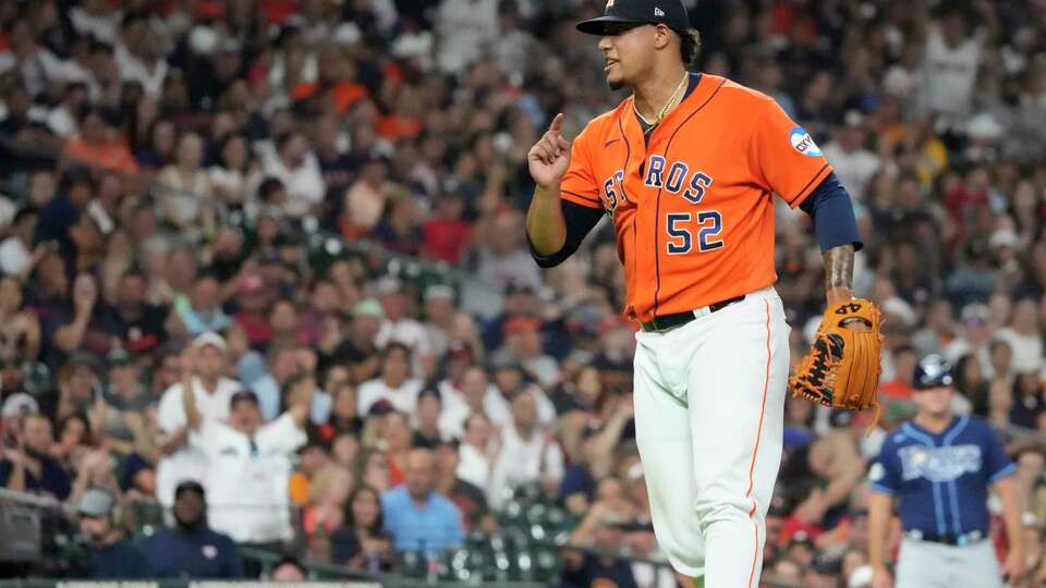 Houston Astros relief pitcher Bryan Abreu (52) reacts after striking out Tampa Bay Rays Josh Lowe (15) during the eighth inning of an MLB baseball game at Minute Maid Park on Friday, July 28, 2023 in Houston.