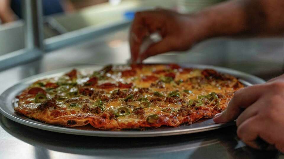 Nonno's Family Pizza Tavern, a retro-inspired restaurant serving tavern-style pizza, serves friends and family ahead of their opening on Saturday, July 29, 2023 in Houston.