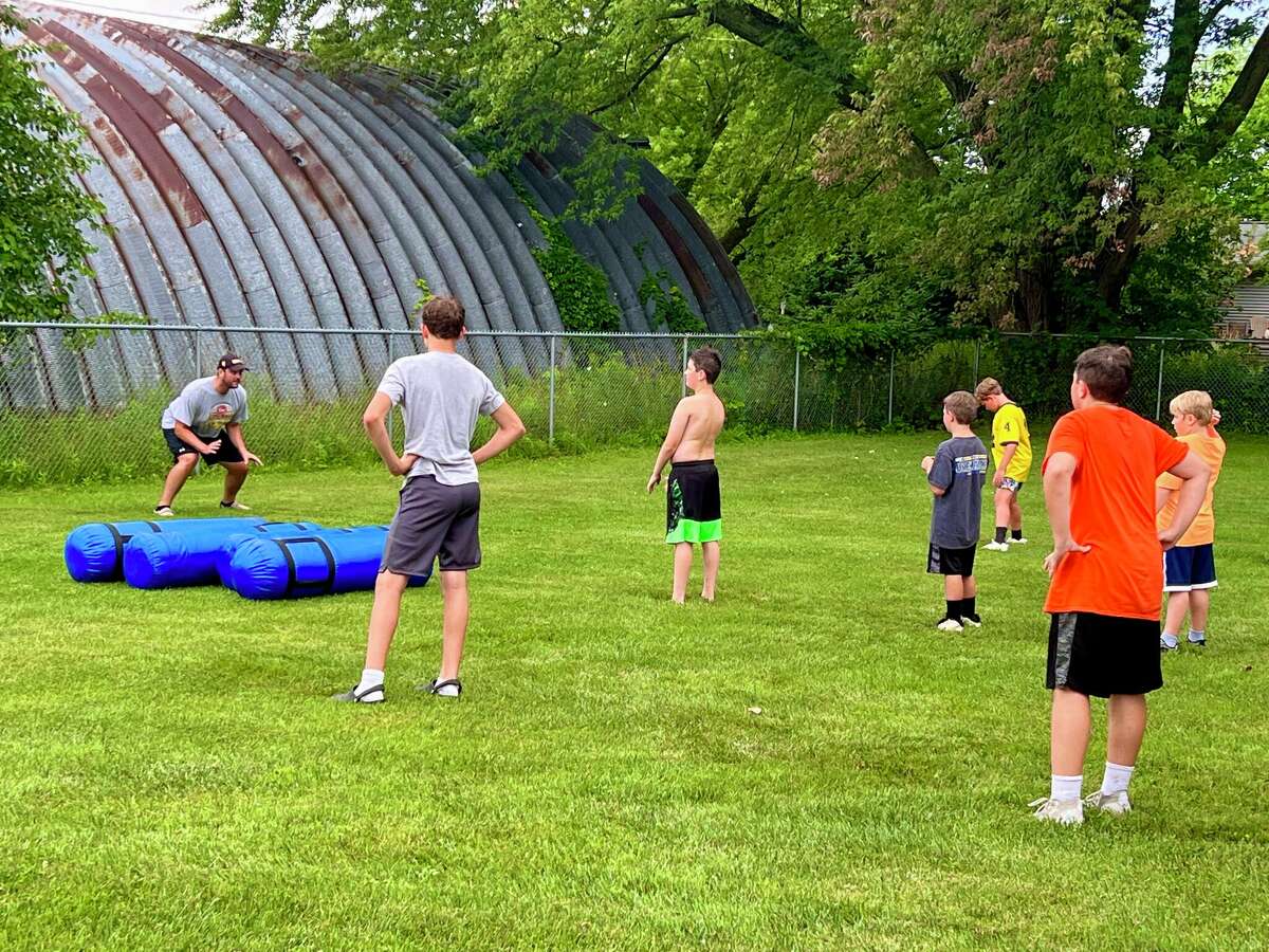 Onekama football Wisniski back to camp