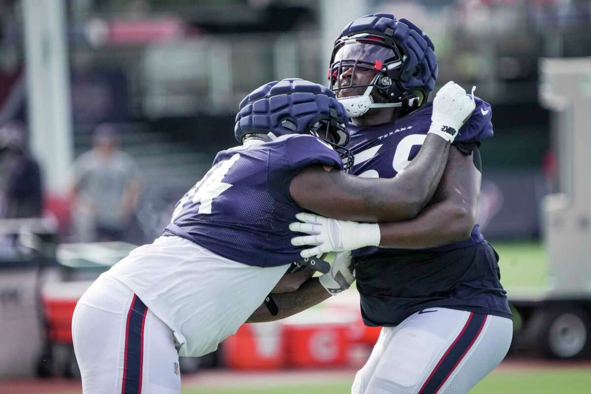 Houston Texans' Adedayo Odeleye (75) stretches during an NFL