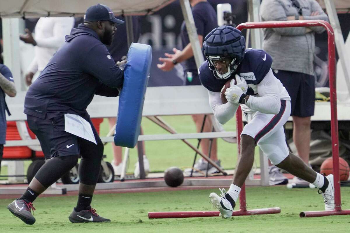 Houston Texans' Adedayo Odeleye (75) stretches during an NFL