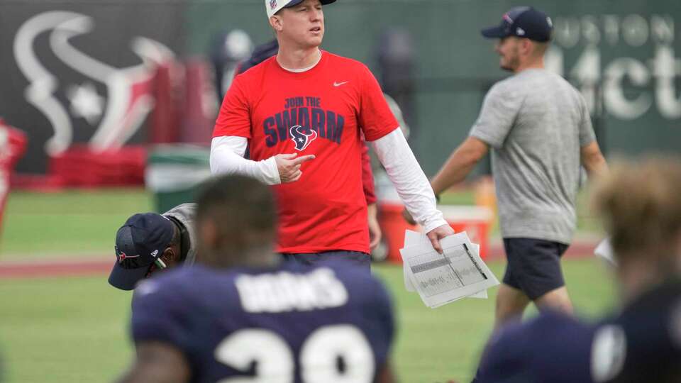 Houston Texans offensive coordinator Bobby Slowik works with the team during an NFL training camp Tuesday, Aug. 1, 2023, in Houston.
