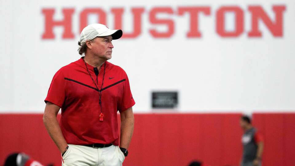 University of Houston head football coach Dana Holgorsen watches players stretch during the first day of practice, Wednesday, Aug. 2, 2023, in Houston.