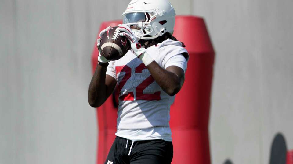 Houston wide receiver Mikal Harrison-Pilot (22) catches a pass during the first day of football practice at the University of Houston, Wednesday, Aug. 2, 2023, in Houston.