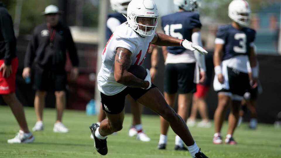 Houston wide receiver Jonah Wilson (14) runs after making a catch during the first day of football practice at the University of Houston, Wednesday, Aug. 2, 2023, in Houston.