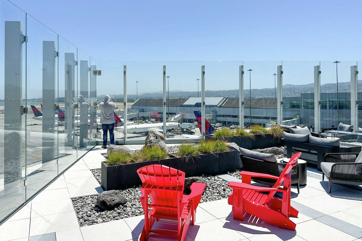 The far corner of the terrace offers the closest look at planes taking off and landing.