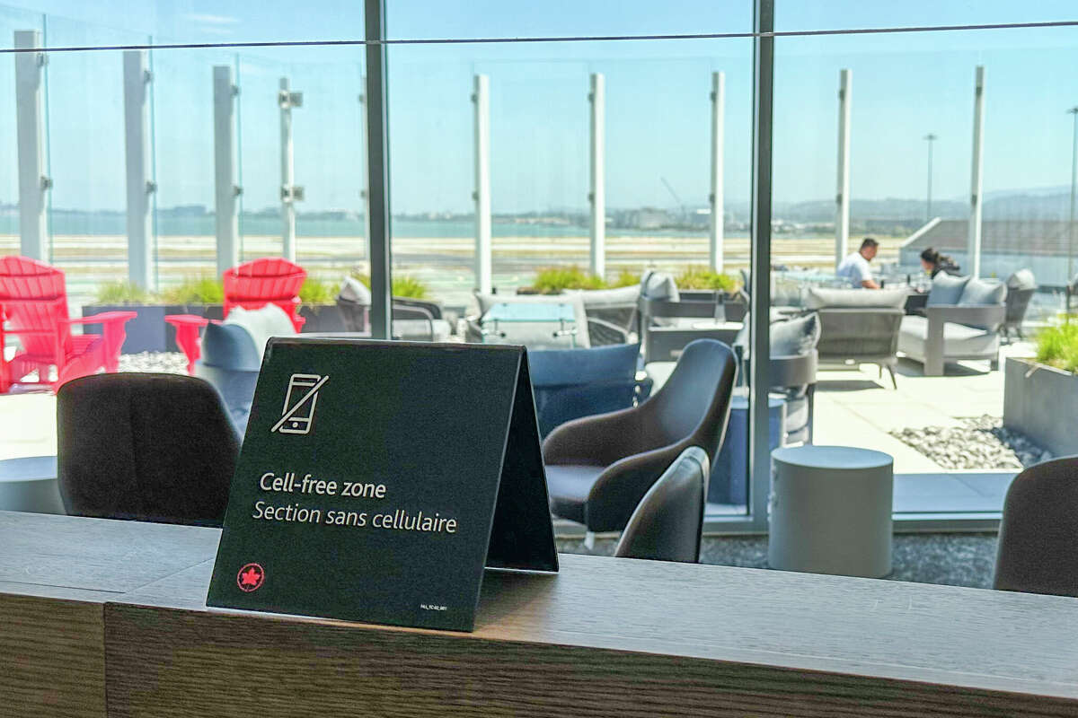 During a leisurely Monday afternoon in July, a few guests of the Maple Leaf Lounge gathered in the sunlit cell-free zone near ceiling-high windows at SFO.