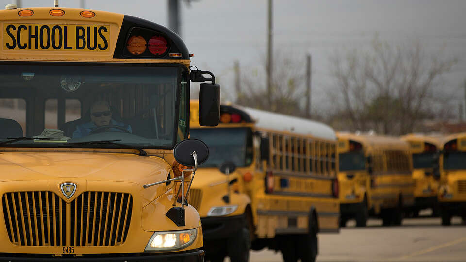 A Houston ISD bus driver leaves the HISD Northwest Shop on the 6300 block of Pinemont Drive as he headed out on a afternoon route in Houston. 