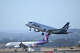 Alaska and Hawaiian Airlines planes take off at the same time from SFO in San Francisco on June 21, 2023.