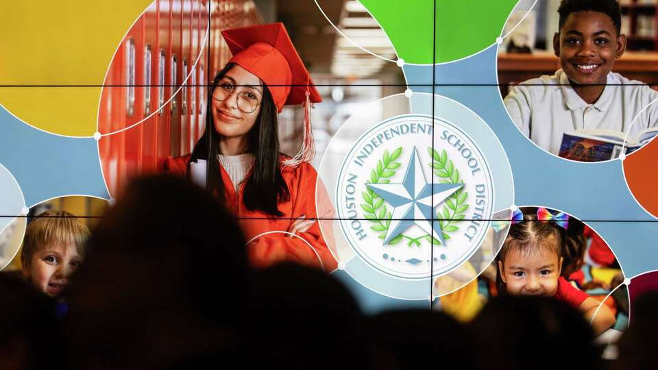 A screen displays the Houston ISD logo during a school board workshop at the Hattie Mae White Education Support Center, Thursday, Aug. 3, 2023, in Houston.