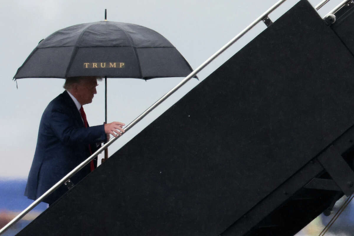 Former President Donald Trump boards his plane at Reagan National Airport following an arraignment in Washington, D.C., federal court on Aug. 3.