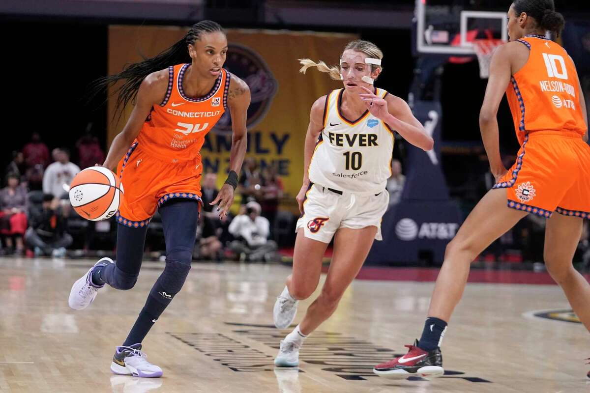 Connecticut Sun's DeWanna Bonner (24) goes to the basket against Indiana Fever's Lexie Hull (10) during the first half of a WNBA basketball game Friday, Aug. 4, 2023, in Indianapolis.
