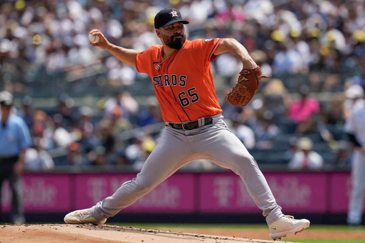 Houston Astros relief pitcher Phil Maton looks at the ball after walking  New York Yankees' Jake Bauers with the bases loaded during the fourth  inning of the baseball game at Yankee Stadium