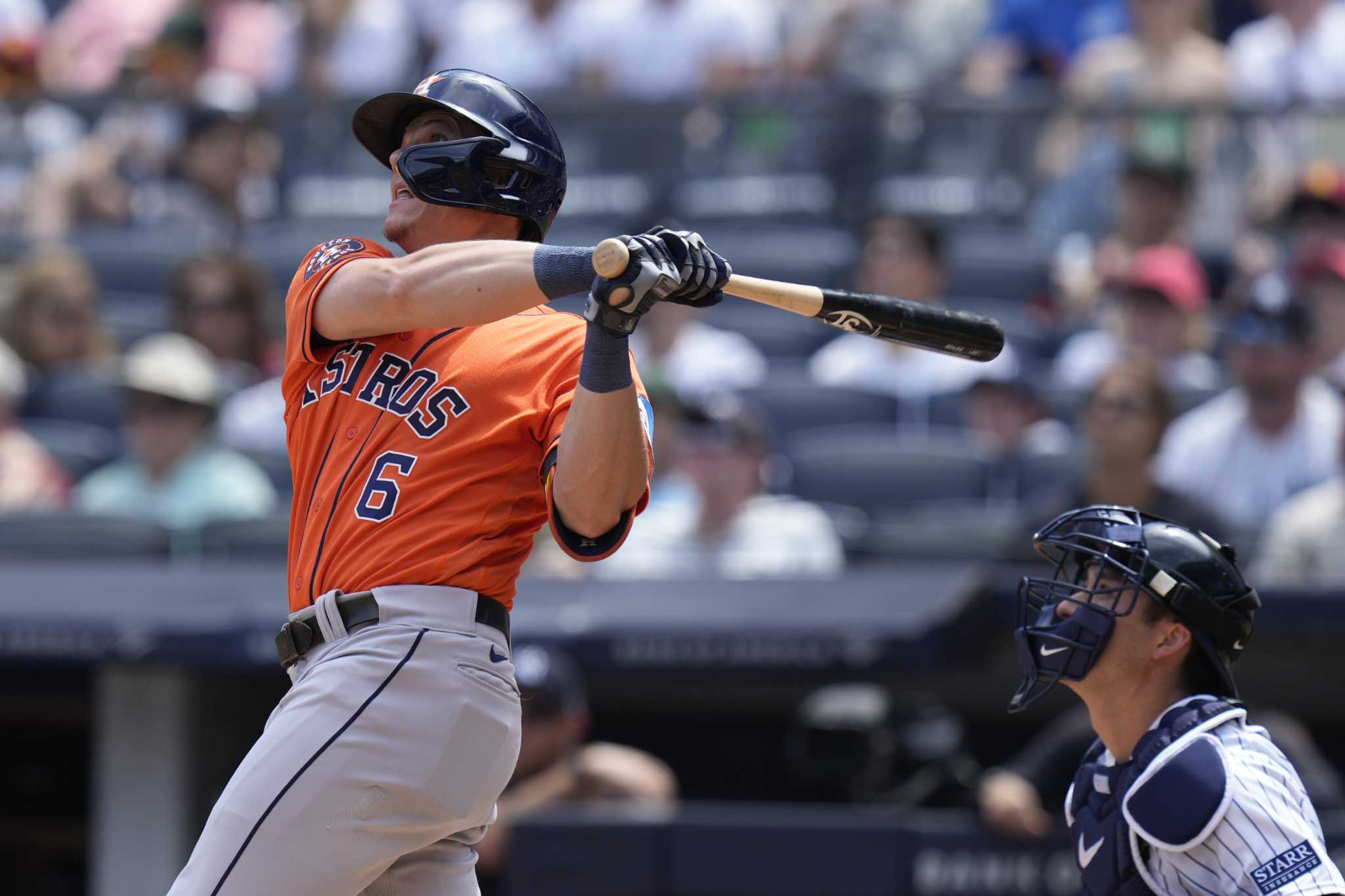 New York Yankees catcher Kyle Higashioka, right, looks on as Houston  Astros' Kyle Tucker (30), second from right, Jeremy Pena, second from left,  greet Jake Meyers after he hit a three-run homer