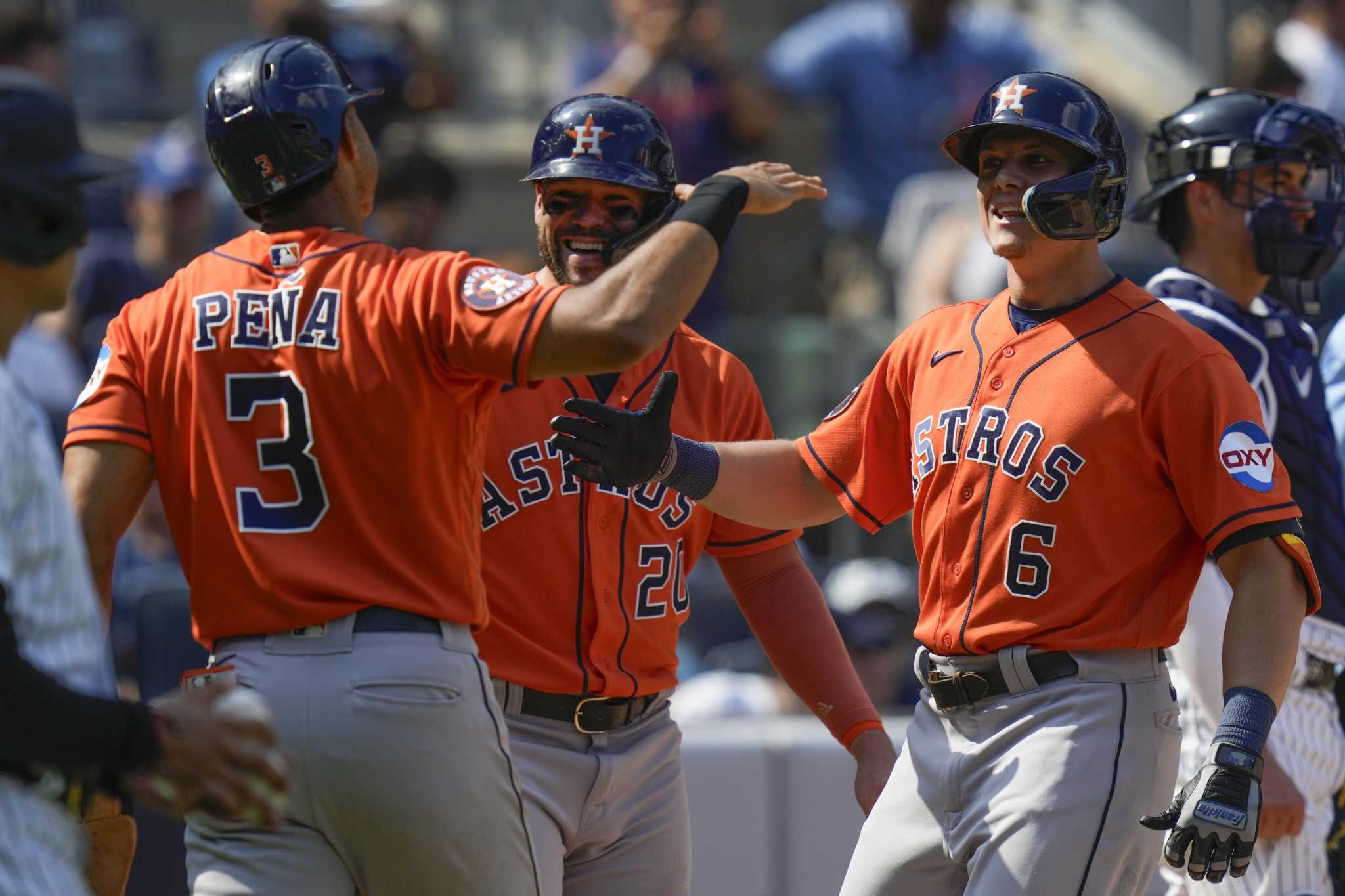 New York Yankees catcher Kyle Higashioka, right, looks on as Houston  Astros' Kyle Tucker (30), second from right, Jeremy Pena, second from left,  greet Jake Meyers after he hit a three-run homer