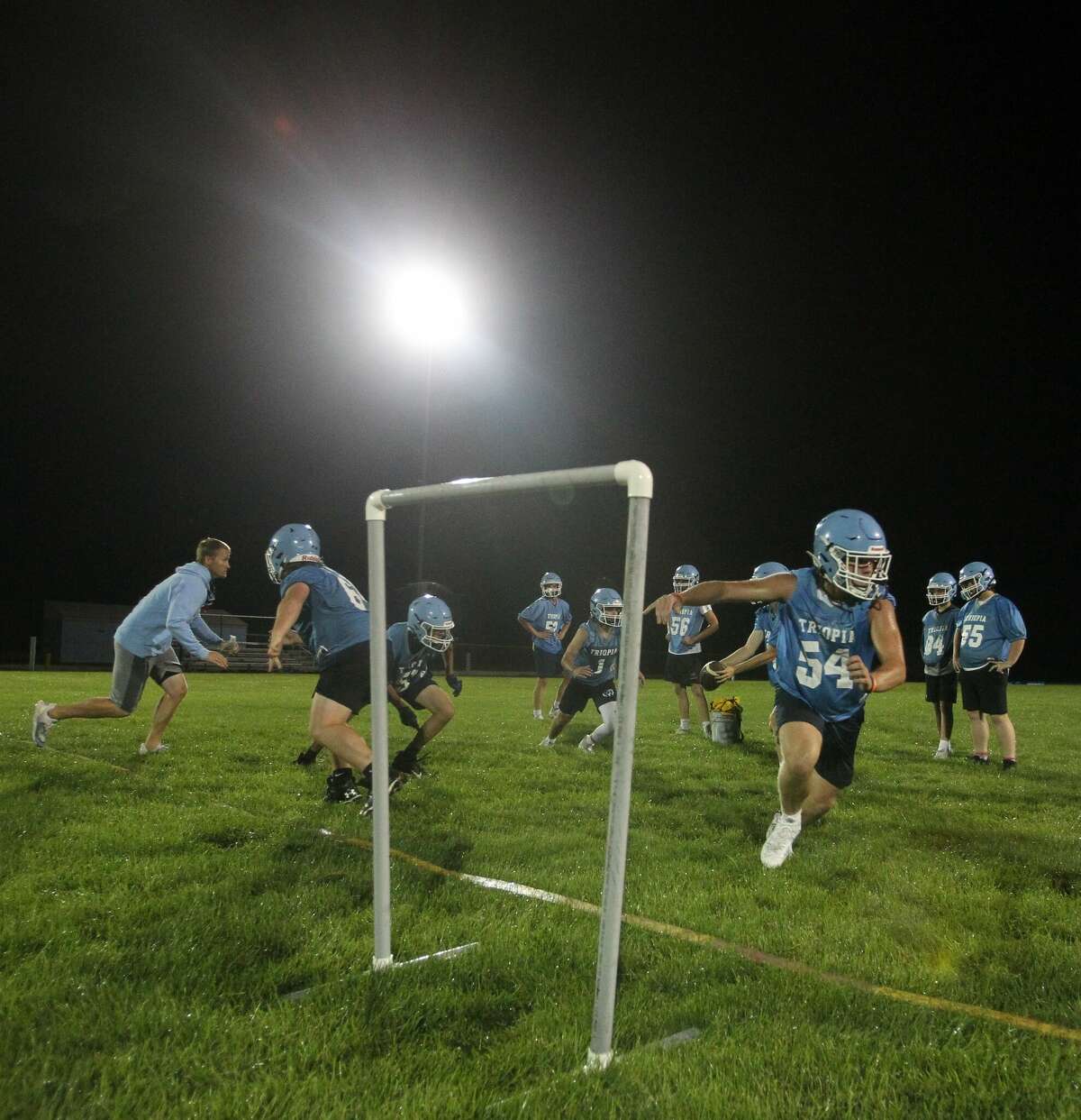 Sunday night lights: Triopia opens with midnight practice