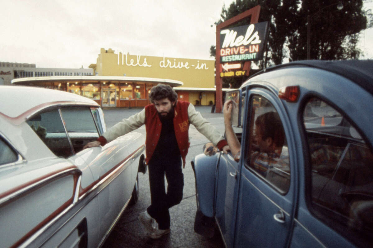 “American Graffiti” director George Lucas pictured at the iconic Mel’s Drive-In diner during the making of the 1973 film. 