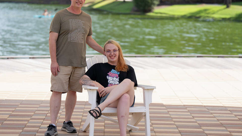 Dr. Craig Henderson, a licensed psychologist, poses for a portrait with his daughter in The Woodlands, TX on August 5, 2023. Henderson's daughter came out as transgender to her parents two years ago.