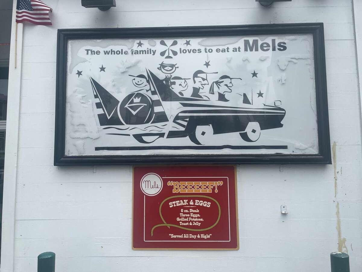 Retro signs hang throughout the Mel’s Drive-In parking lot on Lombard Street in San Francisco.