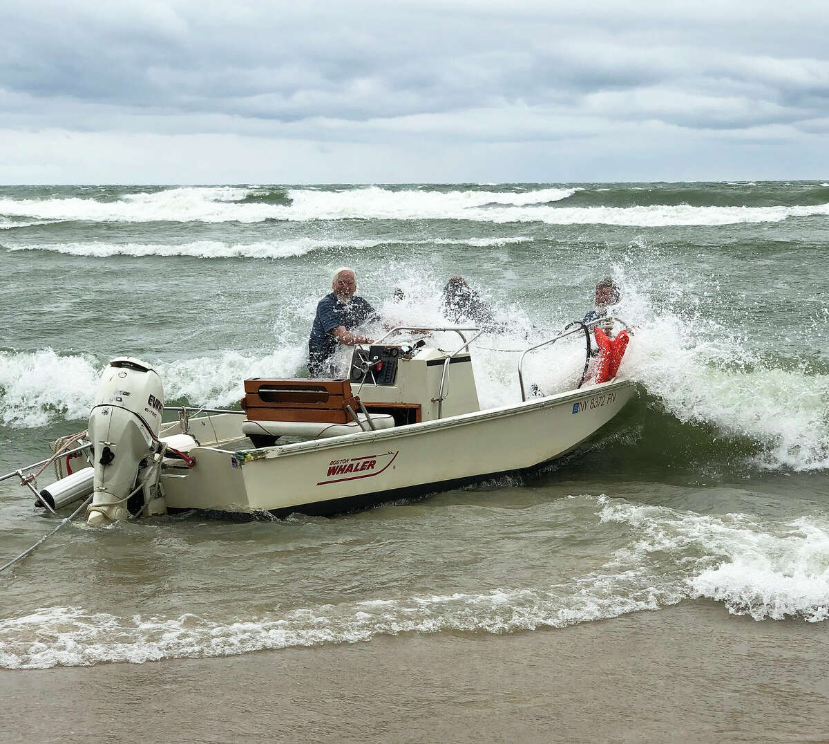 Port Austin lighthouse crew's boat breaks free, washes ashore