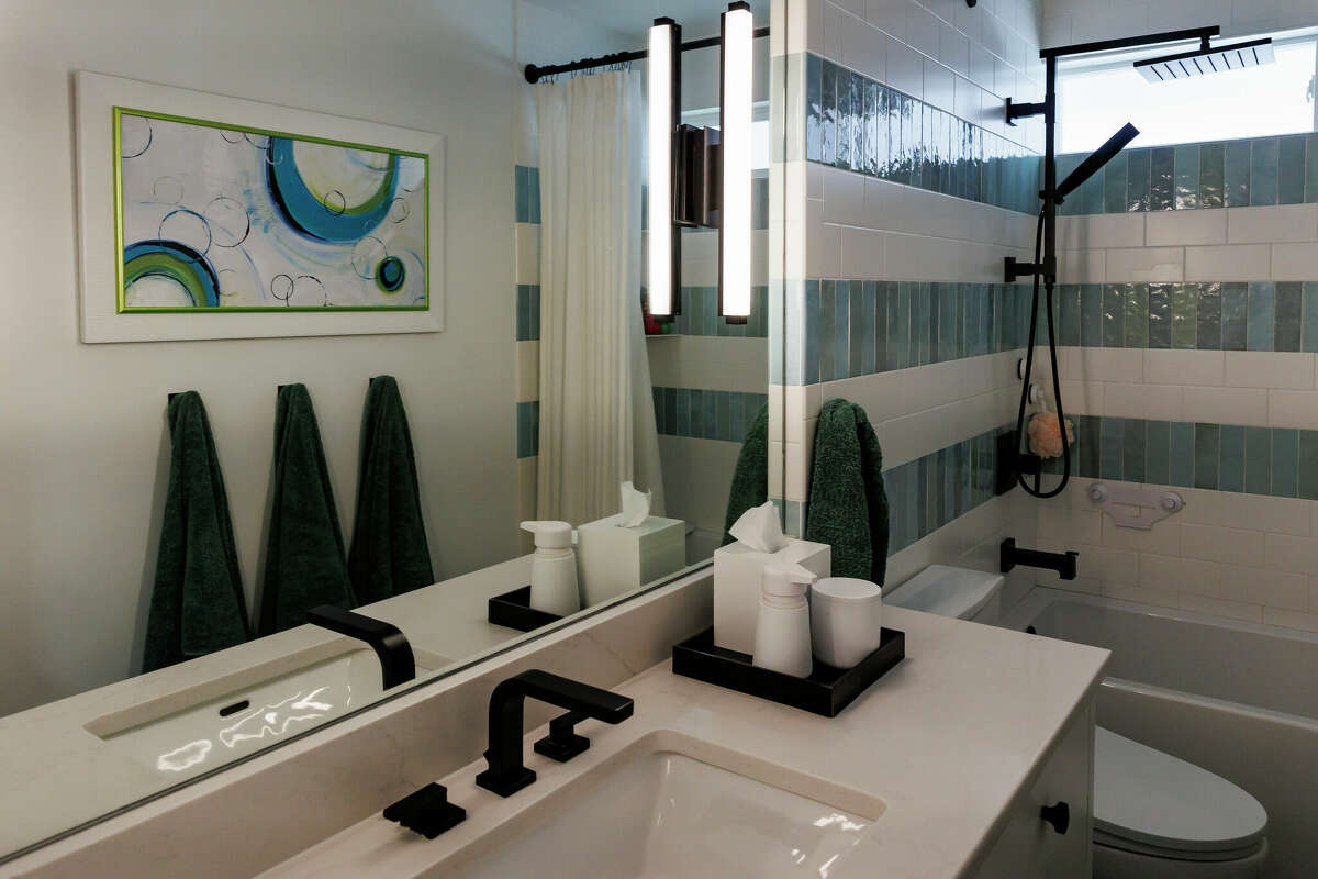 The girls’ bathroom is stylishly designed so they won't outgrow it, and it can serve as a powder room for guests.