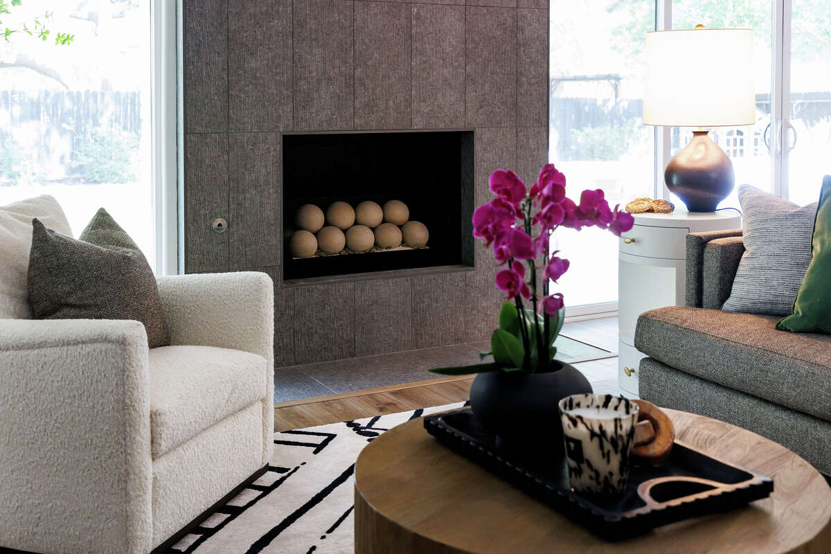 The living area of Michael Volk’s three-bedroom, two-bath home in the Oak Meadow neighborhood has a modern open-concept feel.